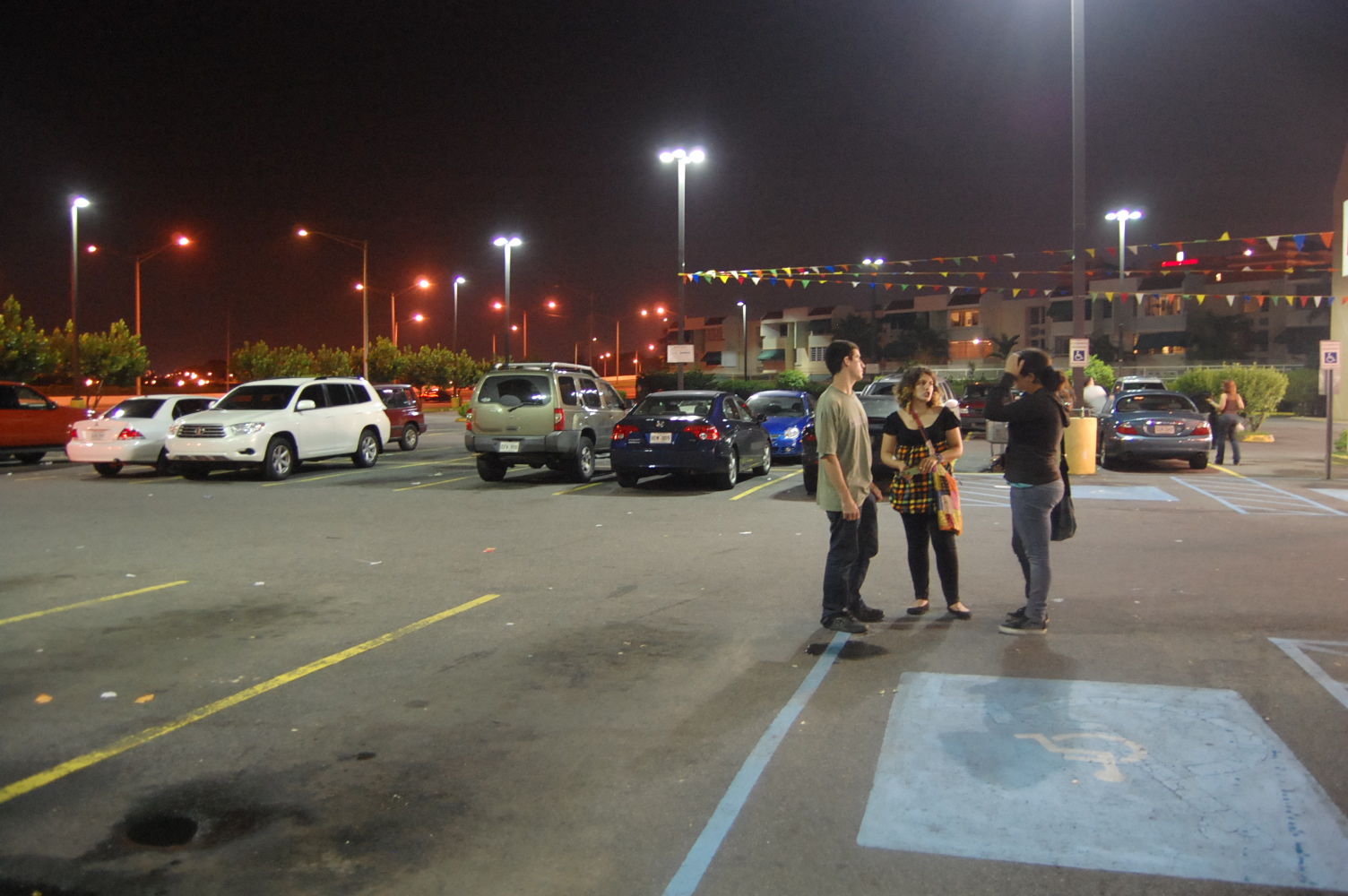 Photograph of conversation in parking lot by Jennifer Kaplan