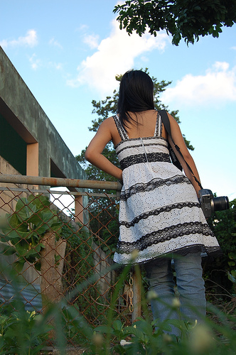 Photograph of girl looking over fence by Jennifer Kaplan